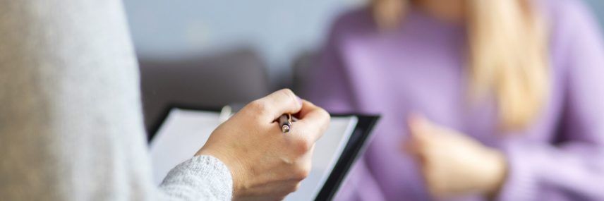 Psychotherapy session, a woman is talking with her psychologist at her office